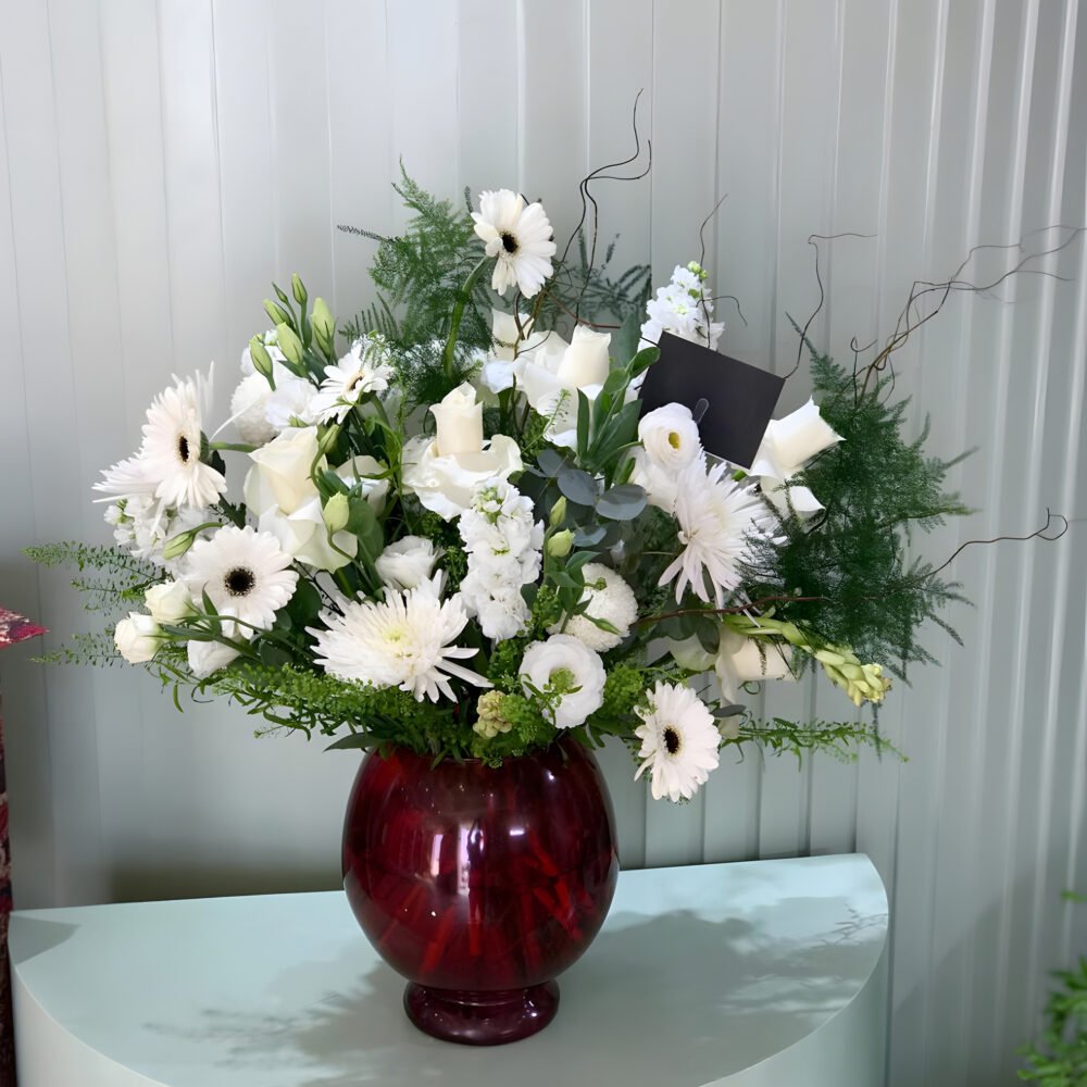 Elegant White Flower Arrangement with Red Glass Vase